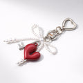 Charms Cuore Metallo con Fiocco – Accessorio per Borsa e Portachiavi Elegante